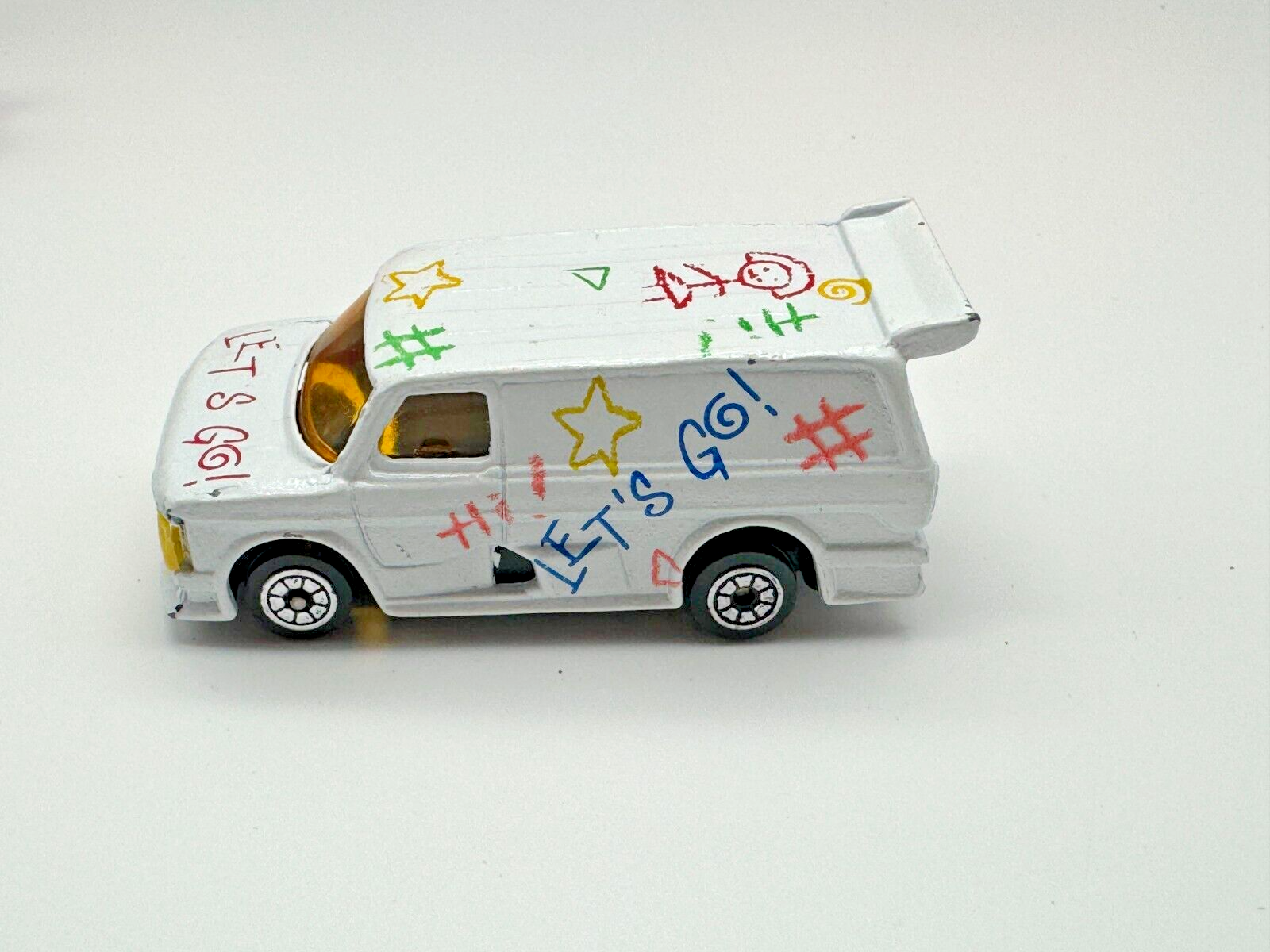 Vintage 80's Diecast White Ford Super Van "Let's Go!" with Crayon-style designs